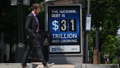 Fed to buy as much government debt as needed to aid economy