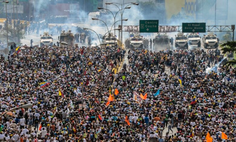 Venezuela protesters protest protests venezuelan crisis caracas cnn unrest march need know thousands