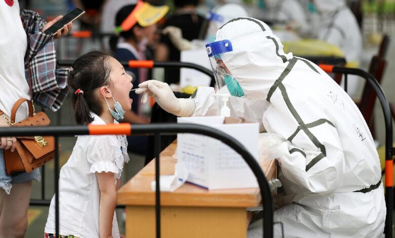 Some chinese high schools reopen as public worries about new virus outbreaks