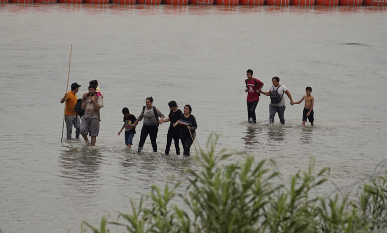 Texas governor says he will defy federal agencys request to remove floating barriers