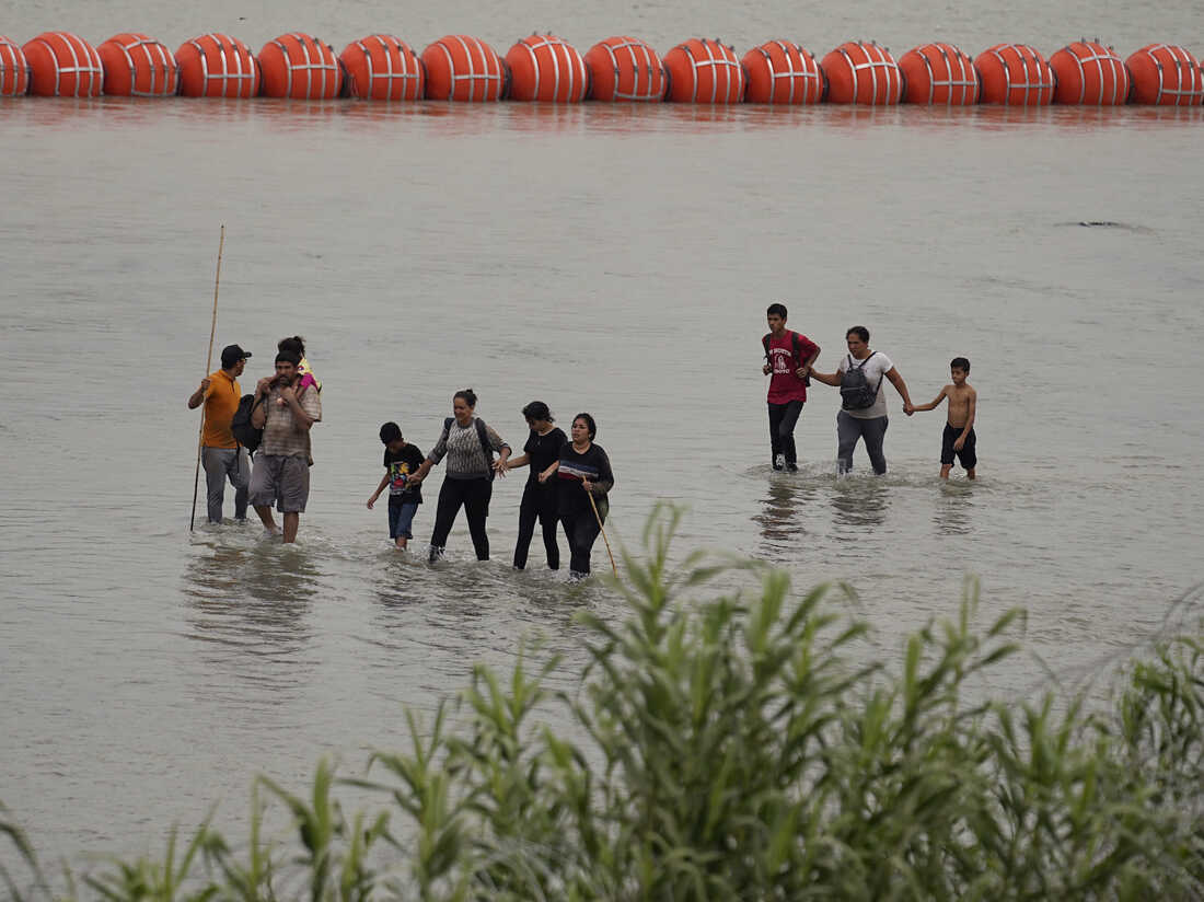 Texas governor says he will defy federal agencys request to remove floating barriers