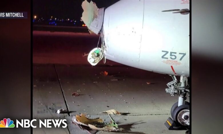 A taxiing airplane collides with a chicago airport shuttle injuring 2 people