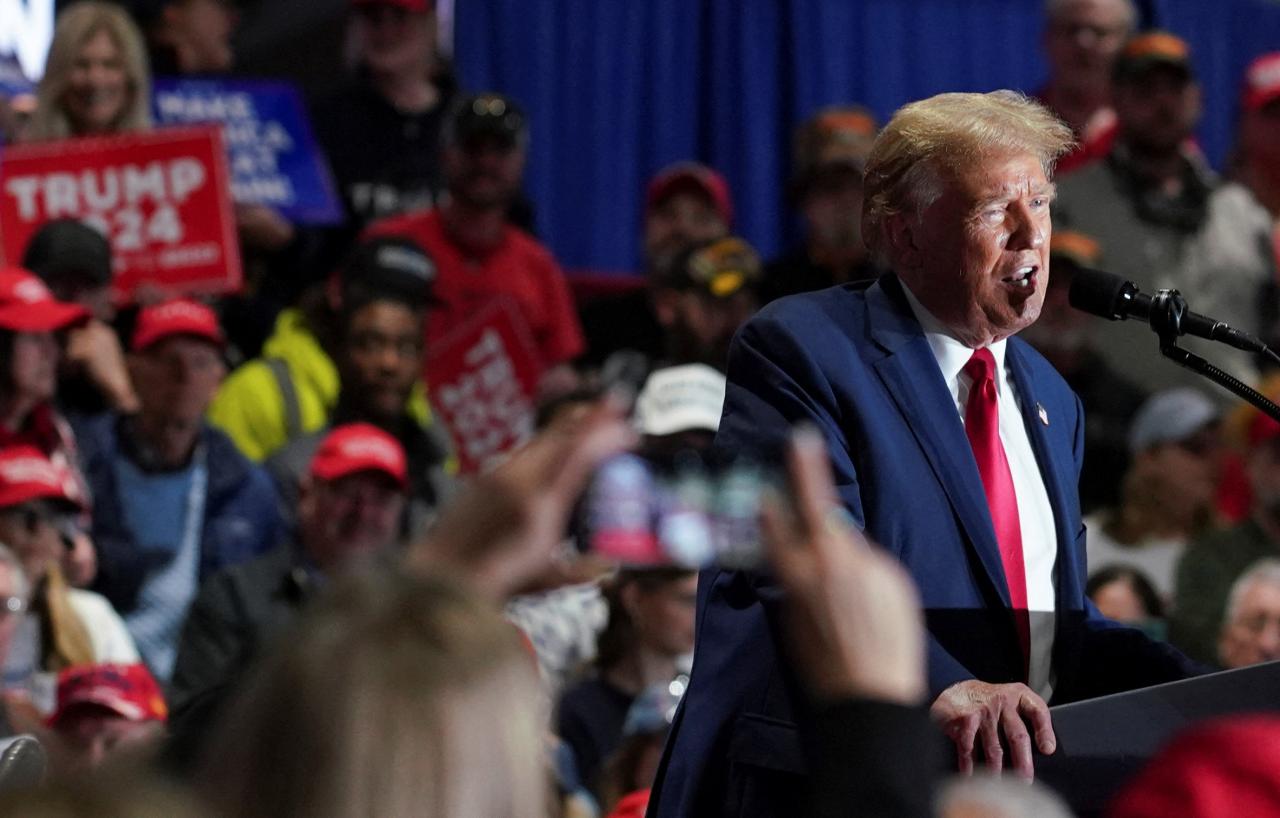 Trump stumps for state candidates in overflowing michigan rally