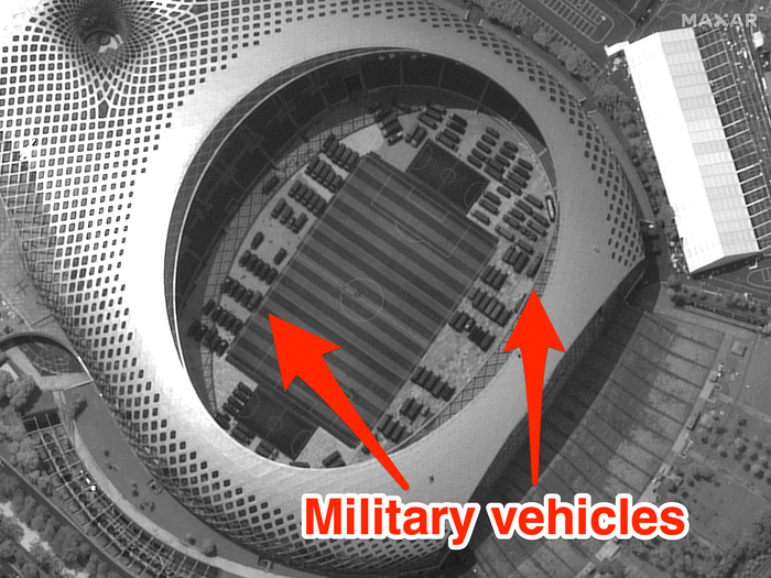 Chinese military vehicles stashed across hong kong border in soccer stadium satellite images appear to show