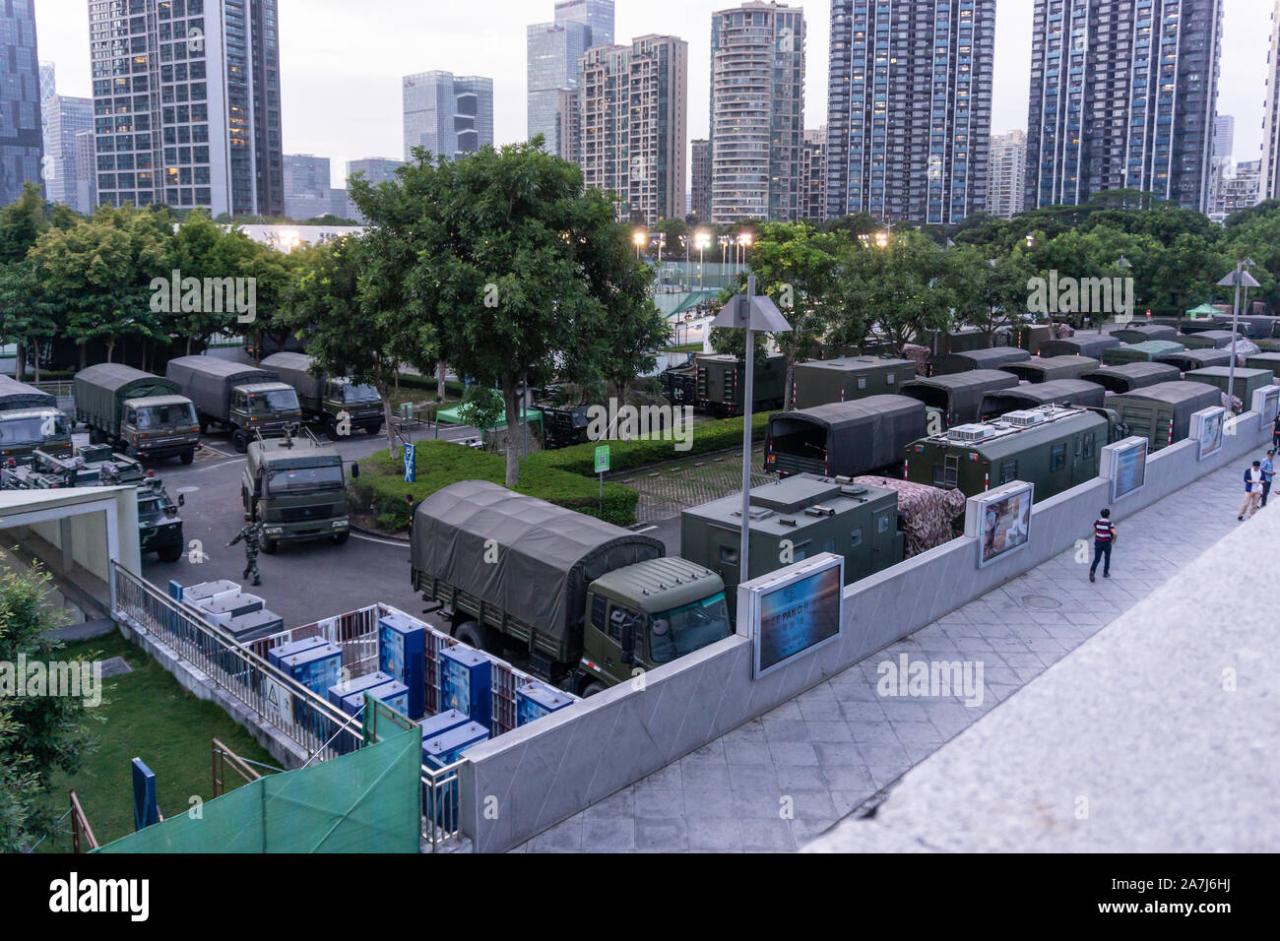 Chinese military vehicles stashed across hong kong border in soccer stadium satellite images appear to show