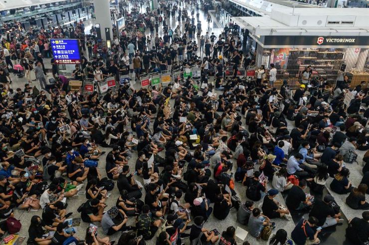 Departing chaos flights protest democracy largely caused protesters Flights resuming at hong kong airport after protest chaos